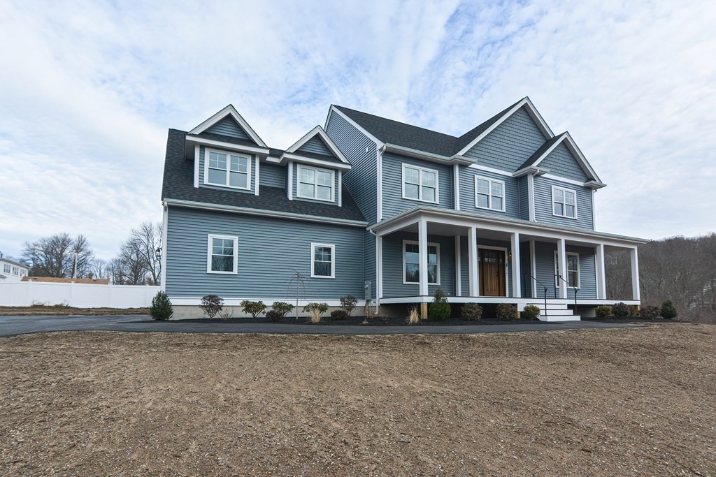 3 Badus Brook Road Wrentham, MA 02093 - Photo 3 of 38 a front view of a house with a yard