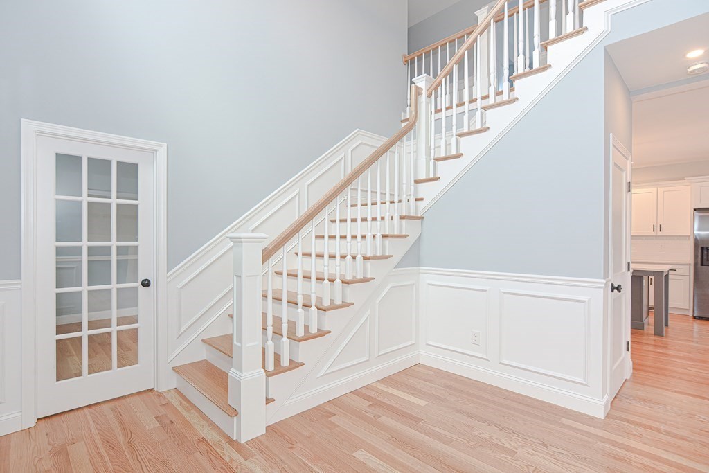 3 Badus Brook Road Wrentham, MA 02093 - Photo 7 of 38 a view of entryway with wooden floor and stairs