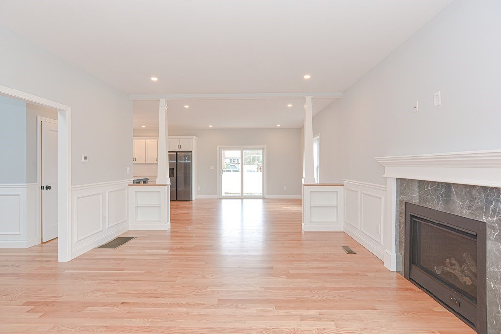 3 Badus Brook Road Wrentham, MA 02093 - Photo 8 of 38 a view of an empty room and a fireplace