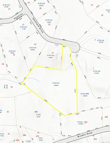 a view of a couch in front of a wall with white walls