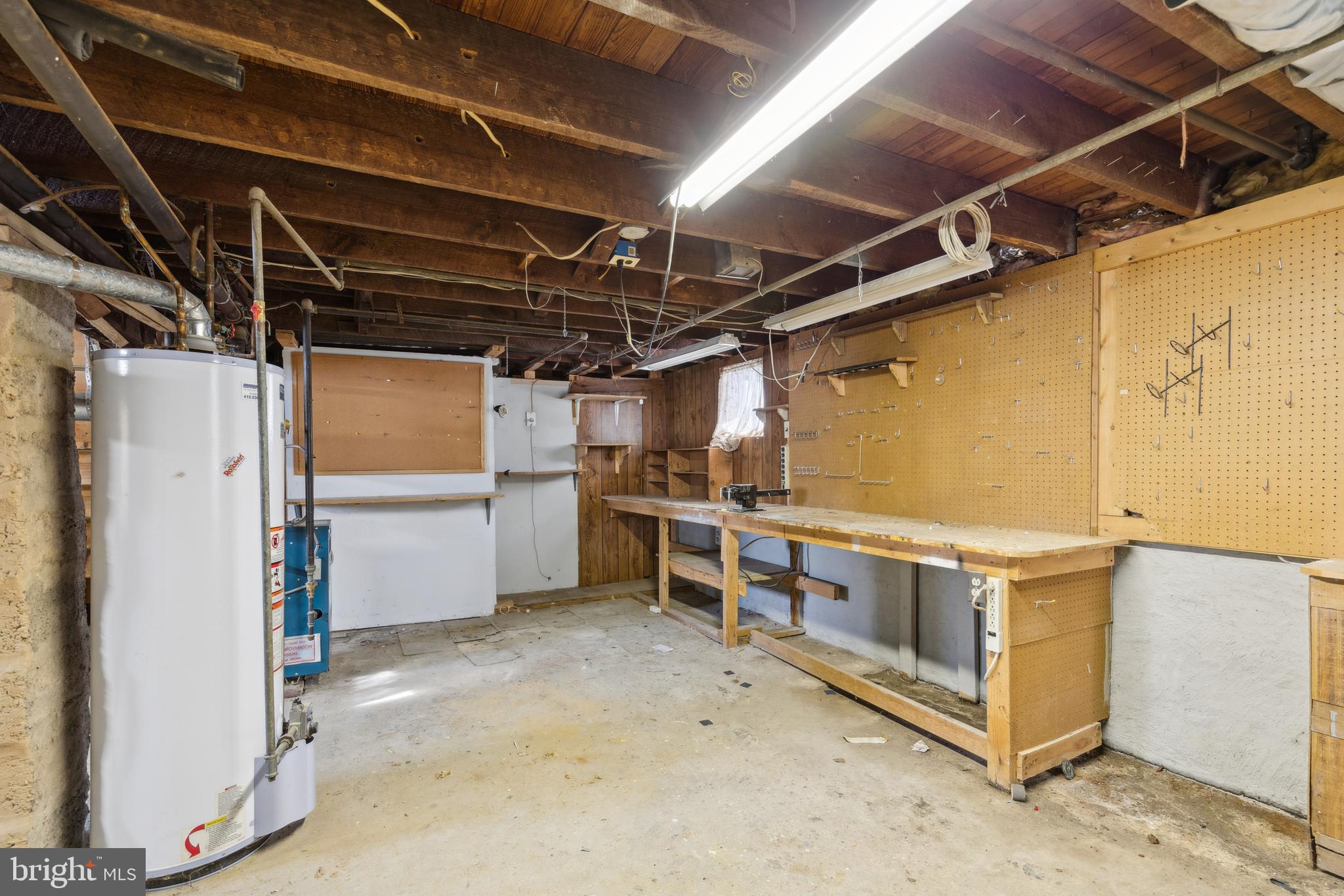8904 Avondale Road Baltimore, MD 21234 - Photo 50 of 69 Unfinished Space with work bench