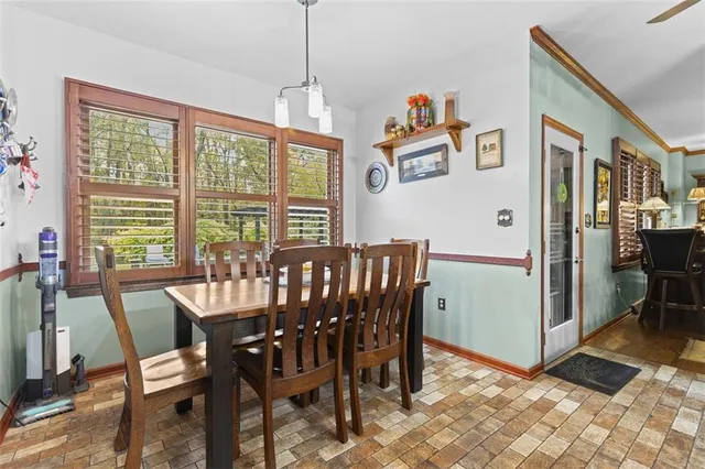 a view of a dining room with furniture window and outside view