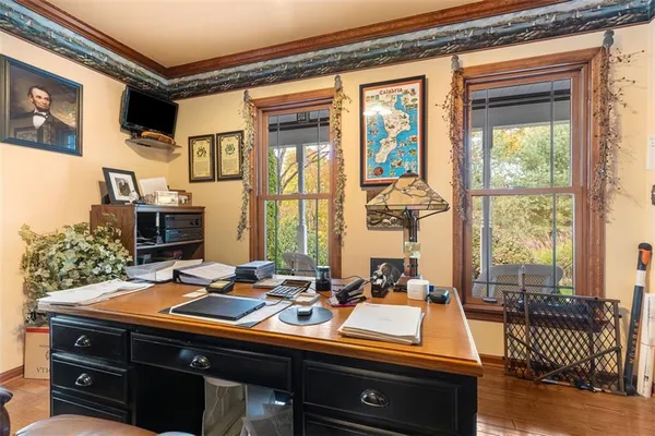 a room with a large window and a table