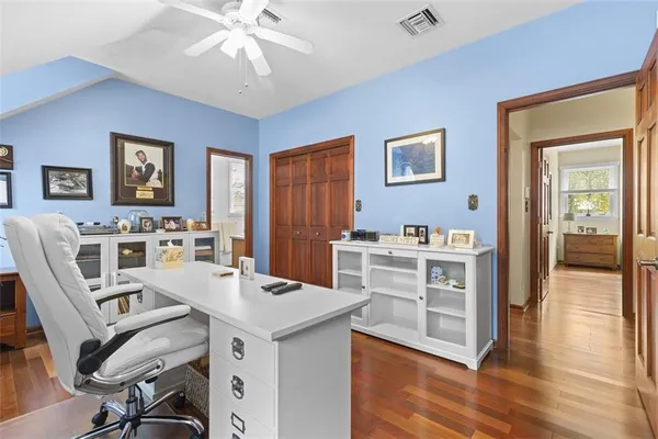 a view of a dining room with furniture and wooden floor