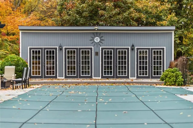 front view of a brick house with a large window