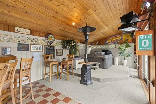 a view of a patio with table and chairs