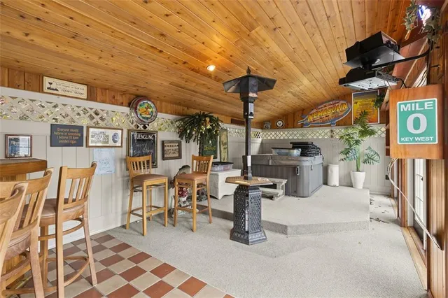 a view of a patio with table and chairs