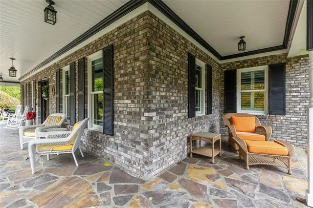 a backyard of a house with lots of green space and garden