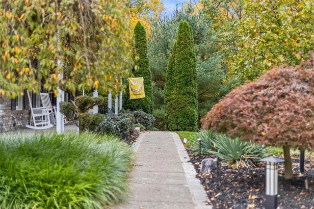 an aerial view of a house with outdoor space