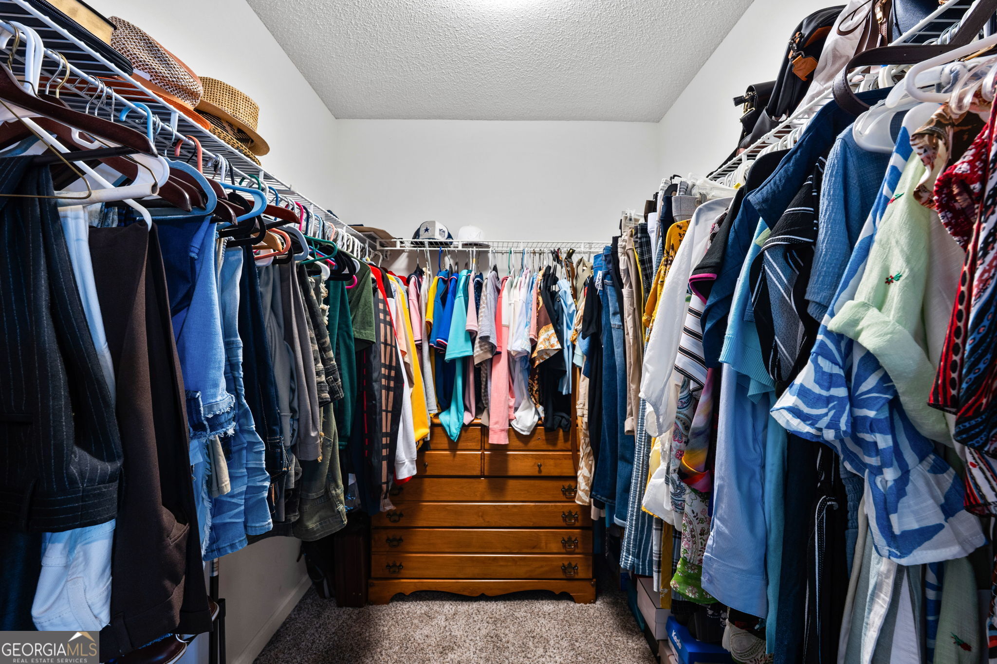 375 Gaelic Way Tyrone, GA 30290 - Photo 31 of 54 a view of walk in closet with clothes and shoes