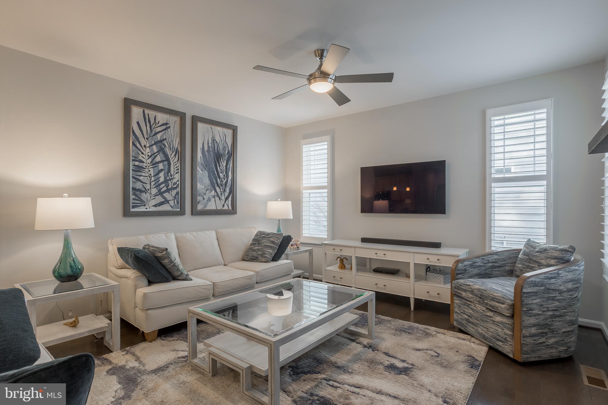 34491 Spring Brook Avenue Lewes, DE 19958 - Photo 14 of 59 a living room with furniture and a flat screen tv