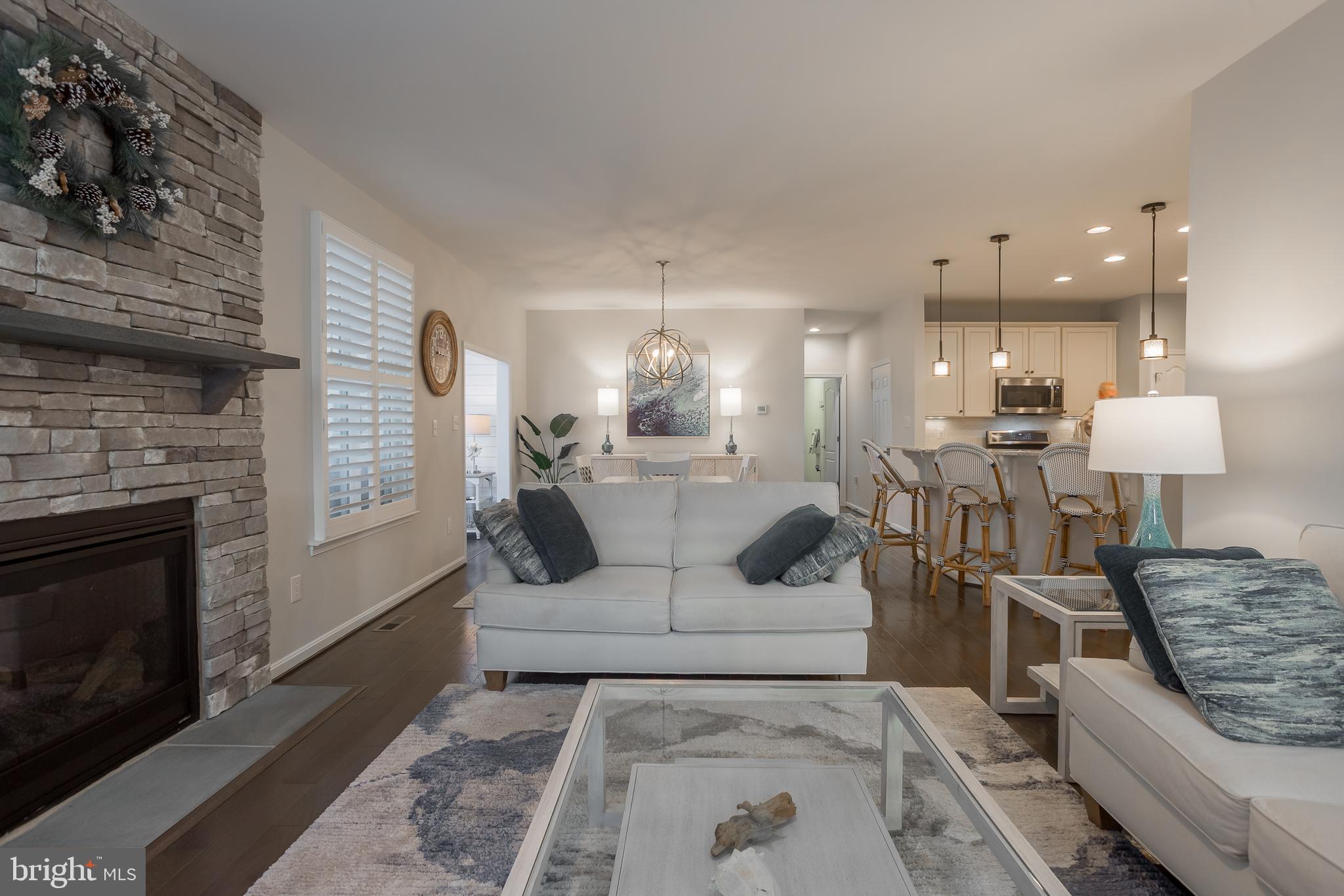 34491 Spring Brook Avenue Lewes, DE 19958 - Photo 15 of 59 a living room with furniture and a fireplace