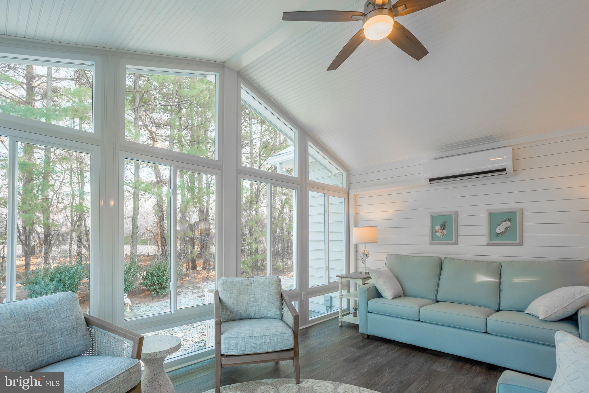 34491 Spring Brook Avenue Lewes, DE 19958 - Photo 19 of 59 a living room with furniture and a large window