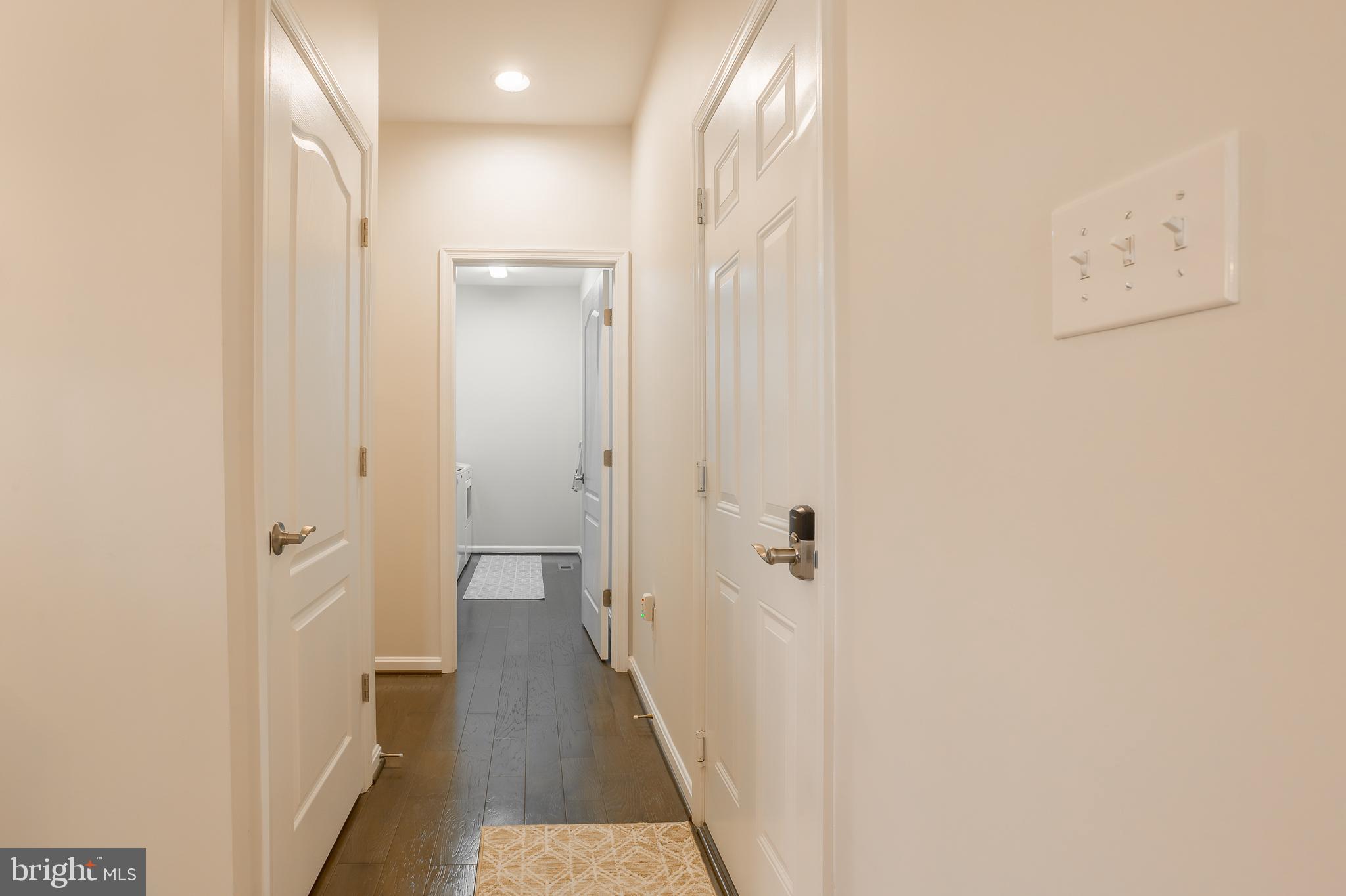 34491 Spring Brook Avenue Lewes, DE 19958 - Photo 28 of 59 HALL TO UTILITY ROOM AND PRIMARY BEDROOM SUITE