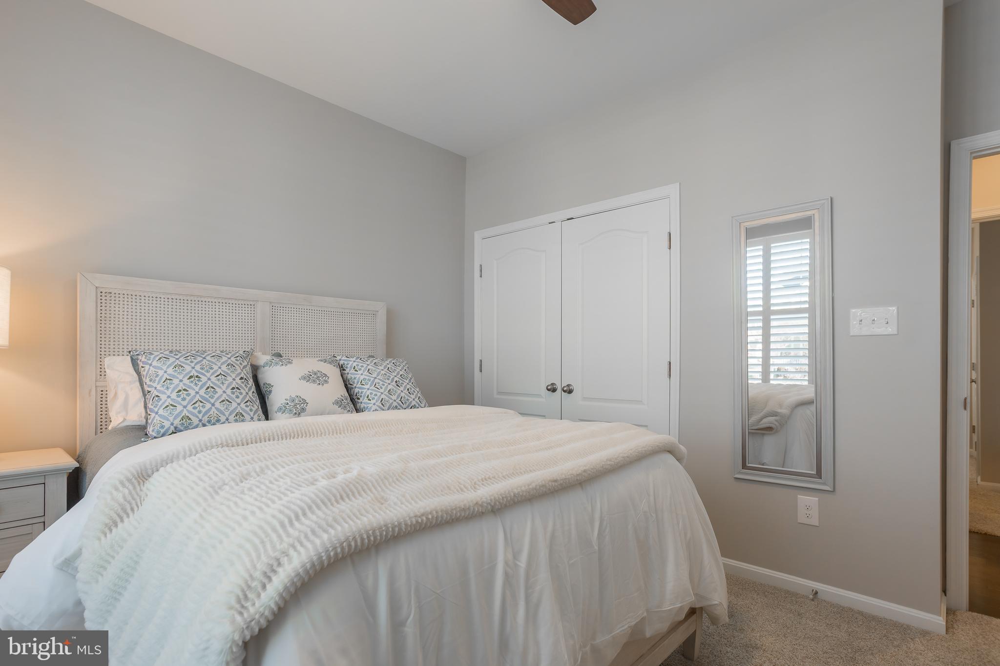 34491 Spring Brook Avenue Lewes, DE 19958 - Photo 31 of 59 a bedroom with a bed and a window