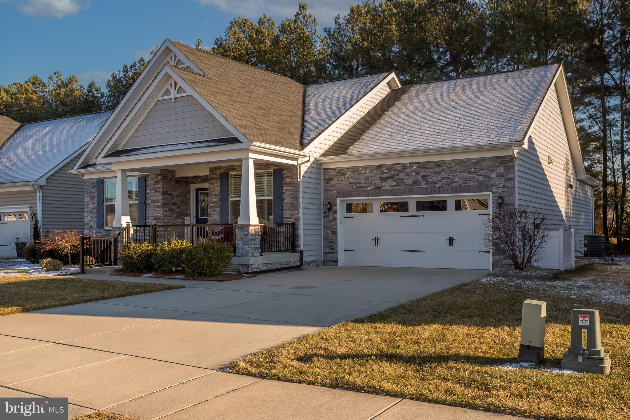 34491 Spring Brook Avenue Lewes, DE 19958 - Photo 41 of 59 a front view of a house with a yard