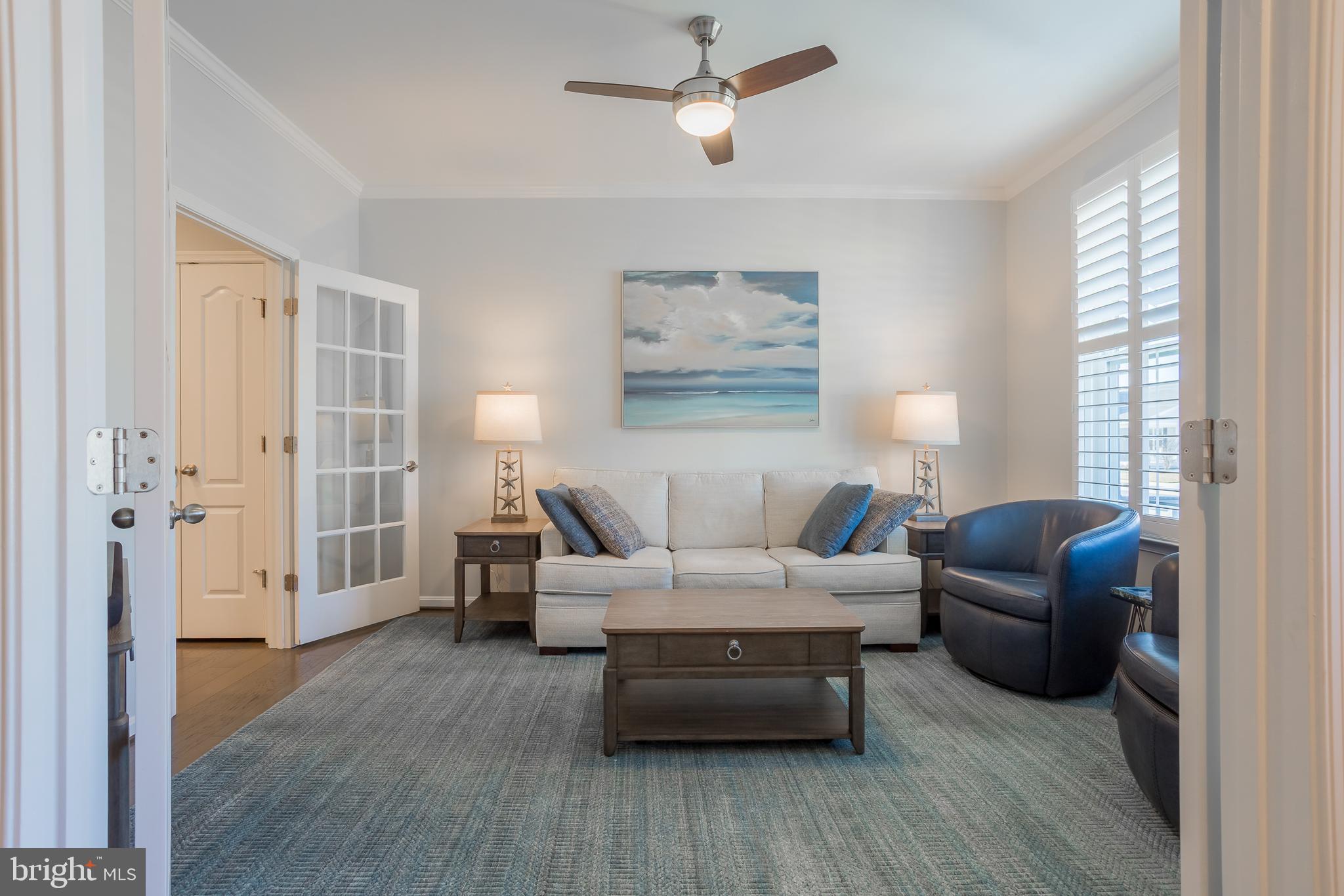 34491 Spring Brook Avenue Lewes, DE 19958 - Photo 5 of 59 a living room with furniture and a wooden floor