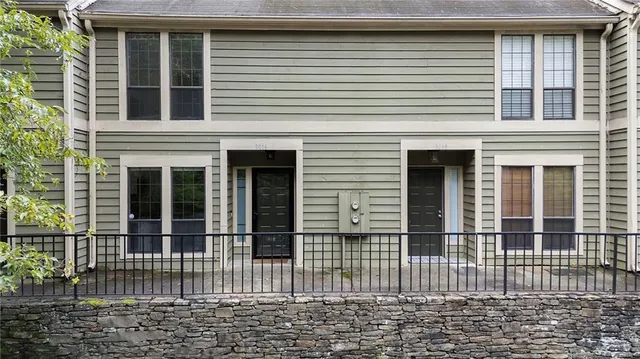 a front view of a house with a glass windows