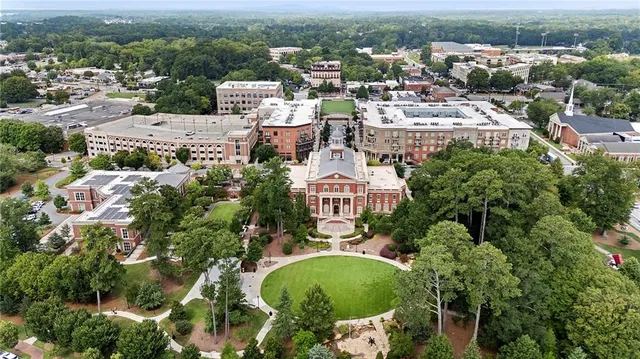 a view of a patio with couches and a big yard