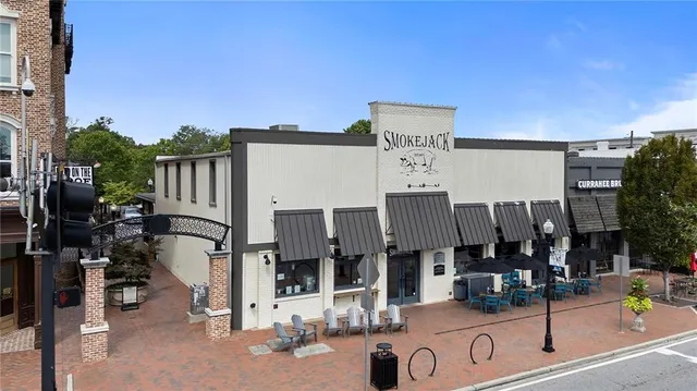 an aerial view of residential house with outdoor space and swimming pool