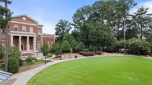 a view of a house with backyard porch and sitting area