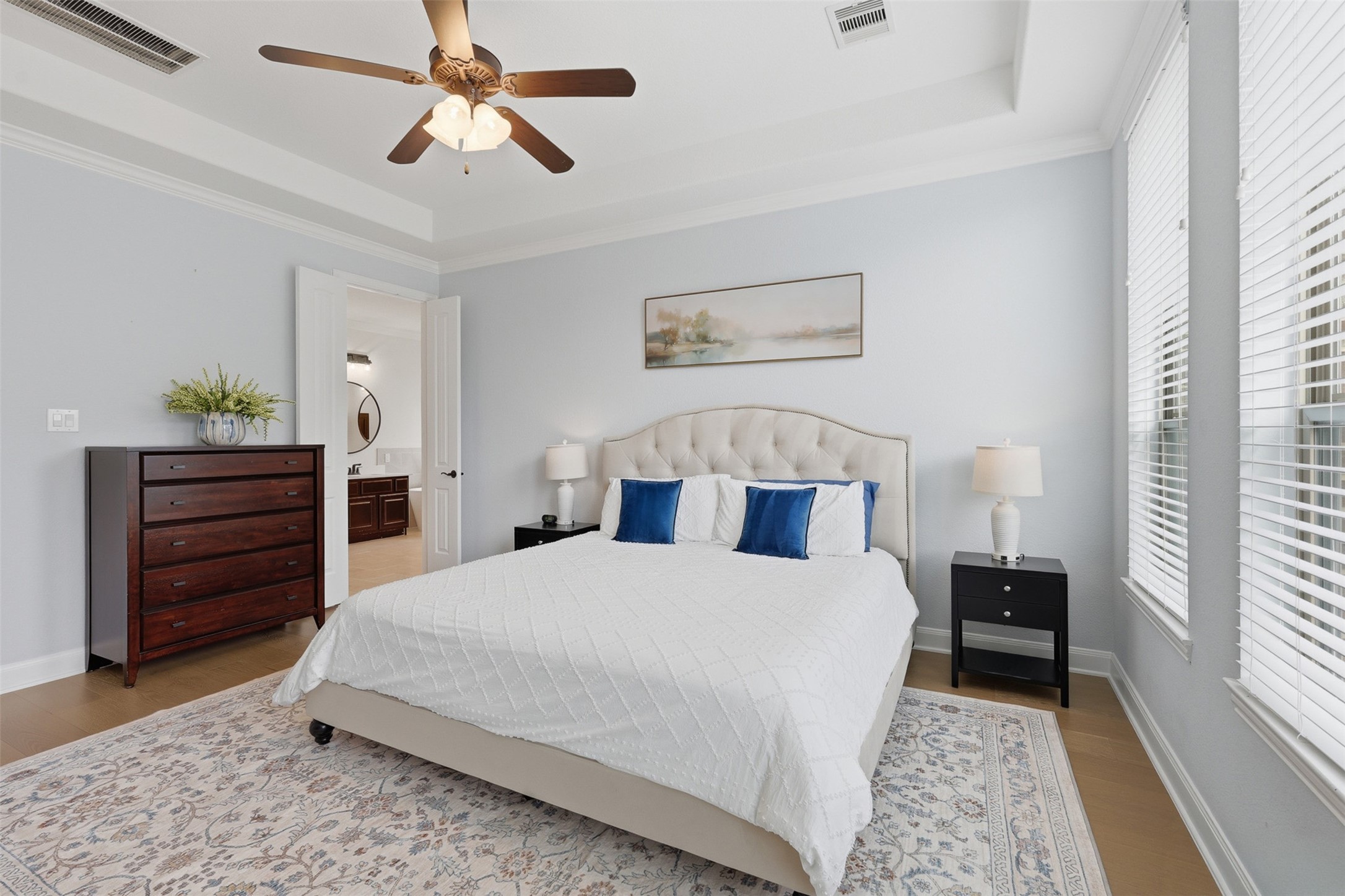 6835 Preston Grove Drive Spring, TX 77389 - Photo 26 of 49 a bedroom with a bed and a chandelier fan
