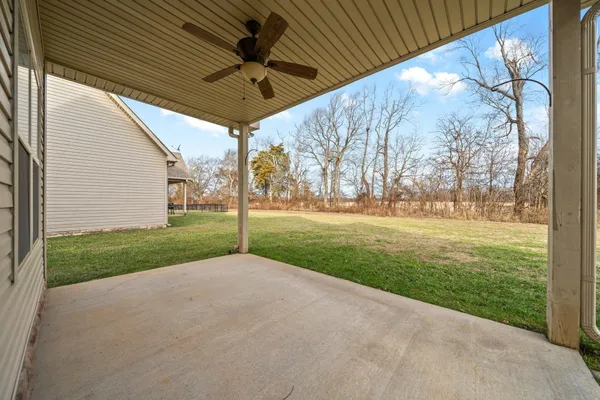 a view of a backyard of the house