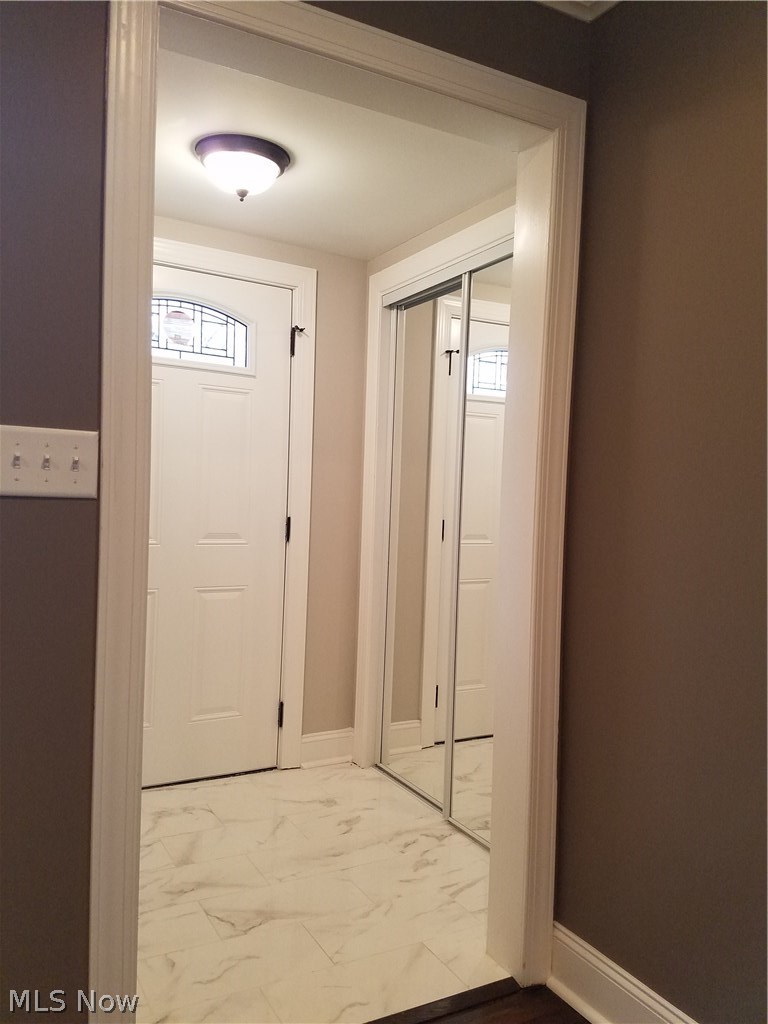 1135 Homestead Road Cleveland, OH 44121 - Photo 3 of 21 front door...marble floor...mirror sliding door