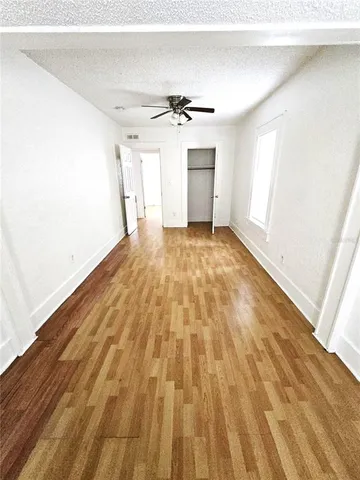 a view of an empty room with a bathroom