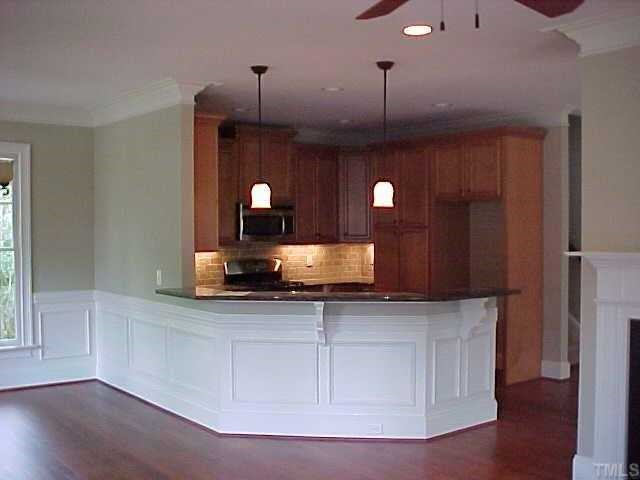1106 North State Street Raleigh, NC 27604 - Photo 3 of 7 a kitchen with a sink and chandelier