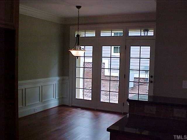 1106 North State Street Raleigh, NC 27604 - Photo 4 of 7 a view of an empty room with a window and wooden floor