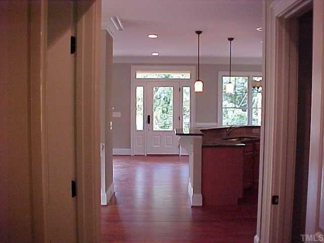 1106 North State Street Raleigh, NC 27604 - Photo 5 of 7 a view of a kitchen with a window and wooden floor