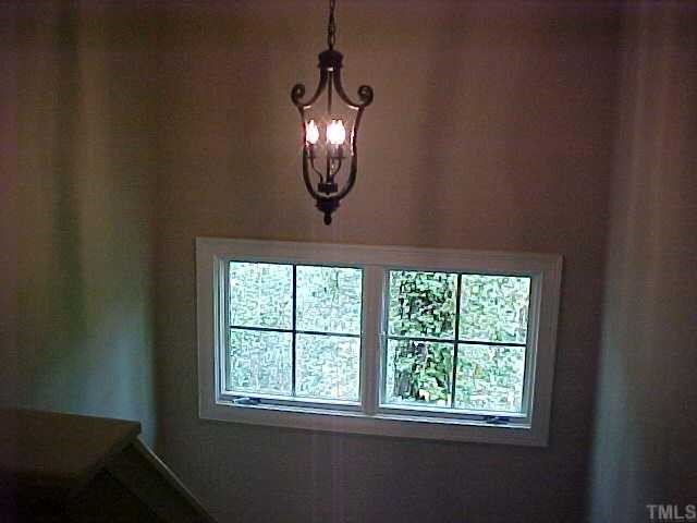 1106 North State Street Raleigh, NC 27604 - Photo 6 of 7 an view of wooden floor chandelier and windows in a room