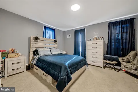 a bedroom with a bed and furniture