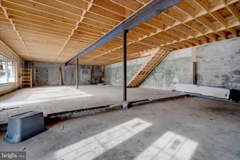 a bed room with a bed and a ceiling fan