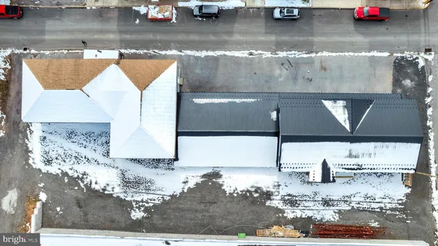 a room with water heater and wooden walls