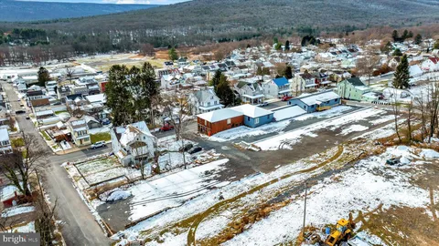 a view of a swimming pool with a lounge chairs