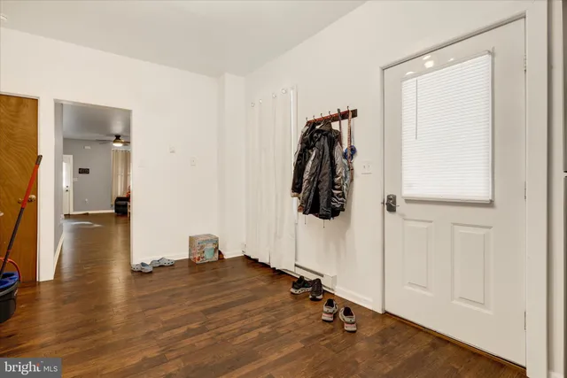 a view of a room with wooden floor and closet