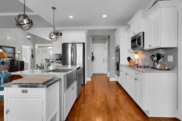 a balcony with furniture and a view of the back