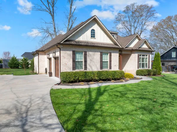a living room with fireplace furniture and a flat screen tv