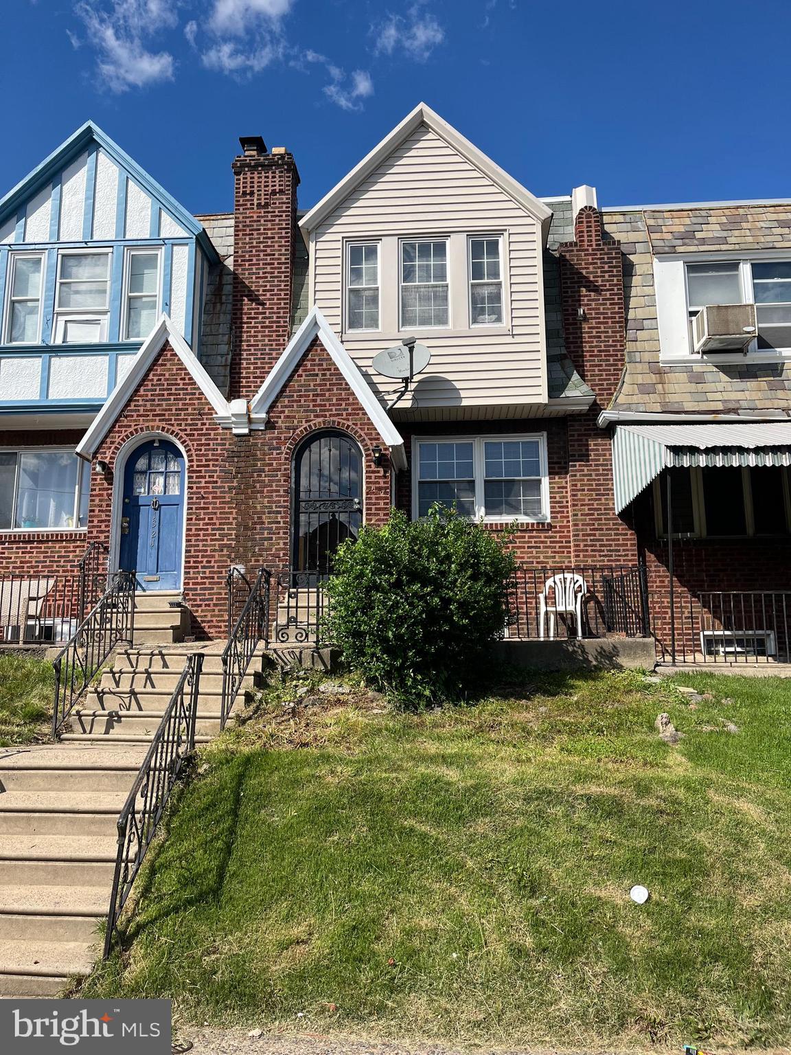 1323 Gilham Street Philadelphia, PA 19111 - Photo 1 of 35 a front view of a house with a garden