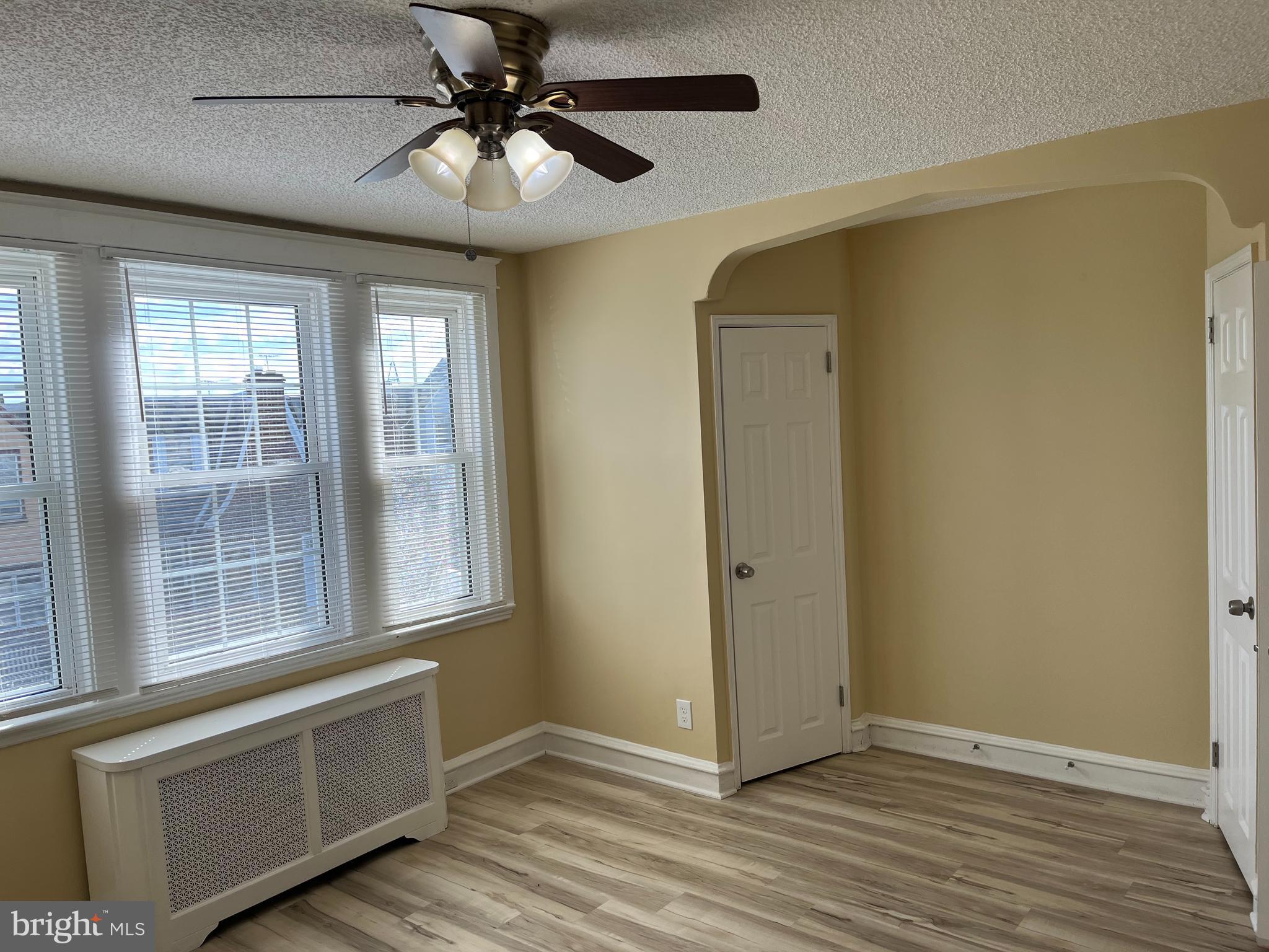 1323 Gilham Street Philadelphia, PA 19111 - Photo 14 of 35 an empty room with wooden floor and windows