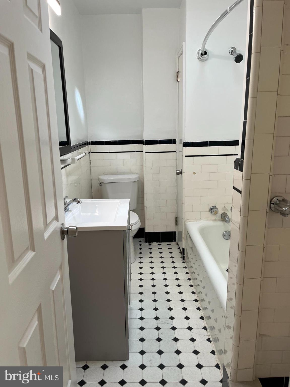 1323 Gilham Street Philadelphia, PA 19111 - Photo 15 of 35 a bathroom with a sink a toilet and shower