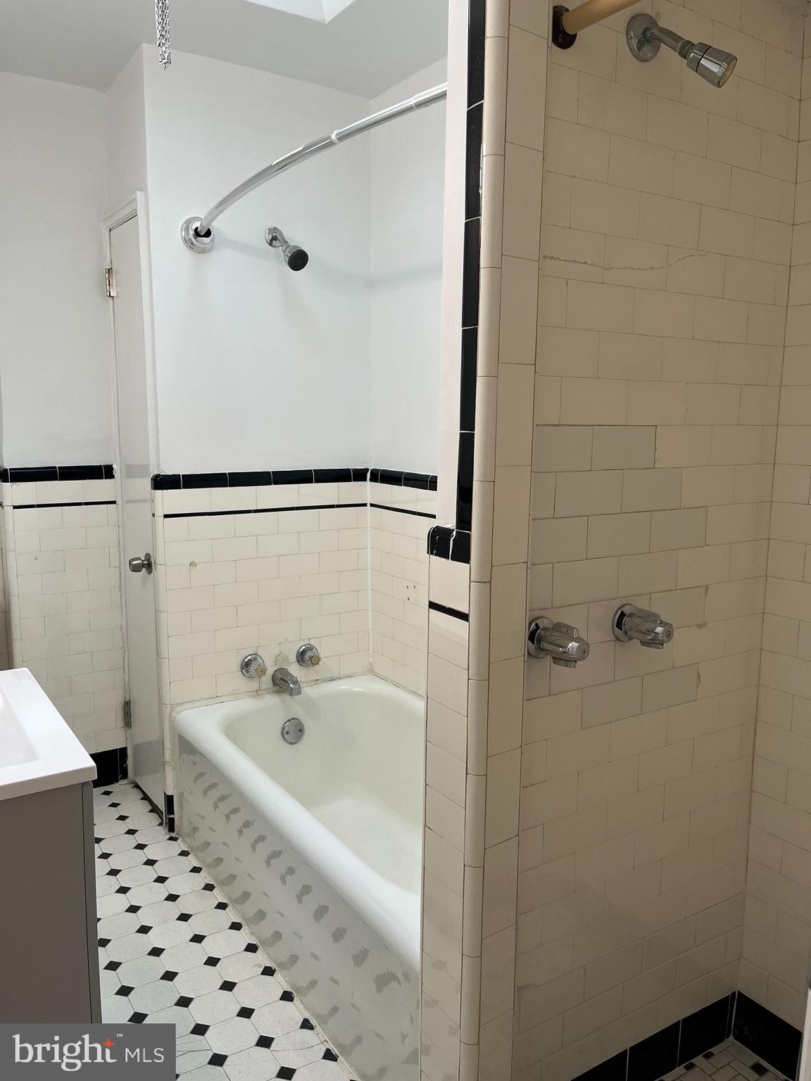 1323 Gilham Street Philadelphia, PA 19111 - Photo 18 of 35 a bathroom with a bathtub and a shower