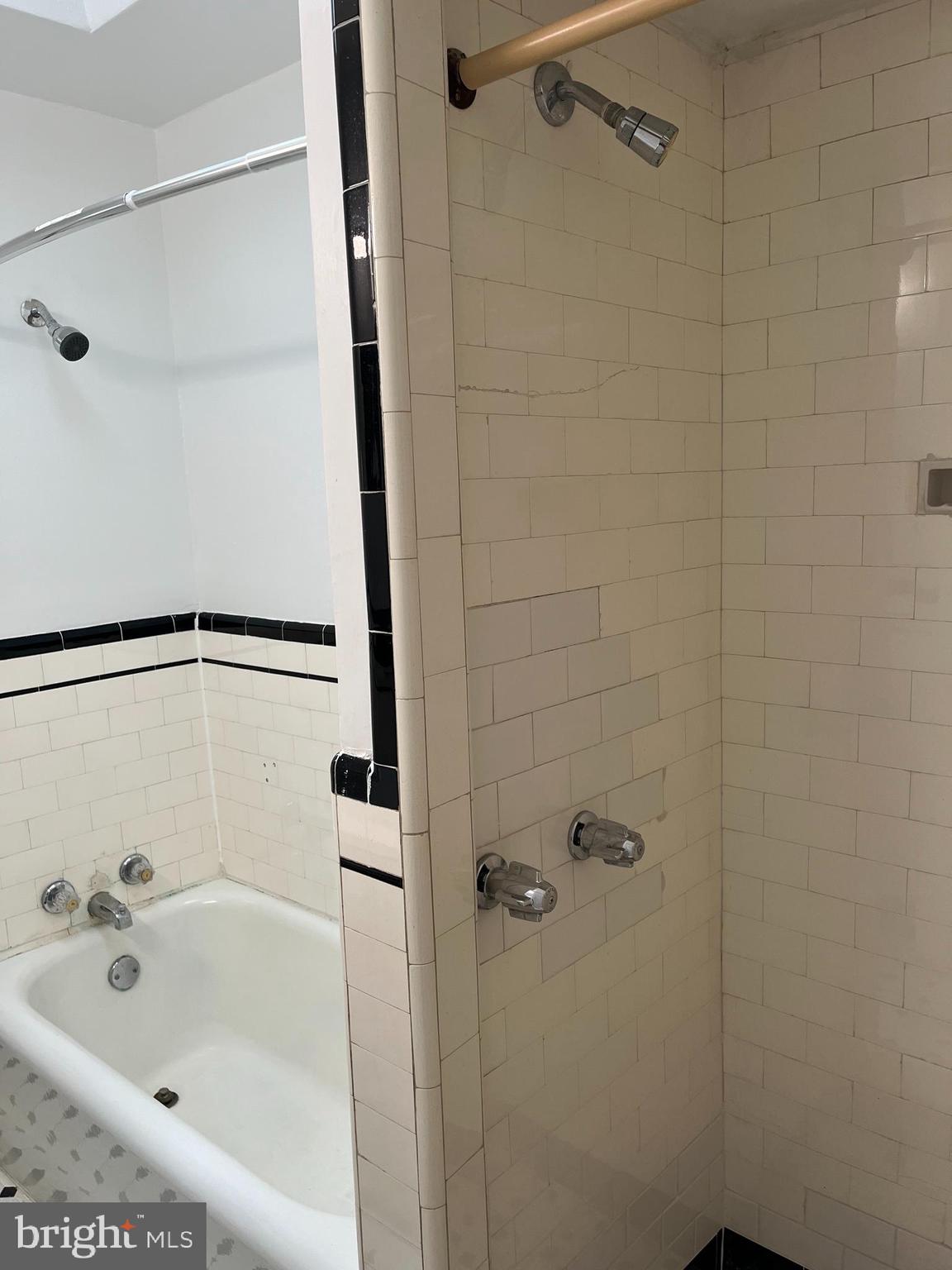 1323 Gilham Street Philadelphia, PA 19111 - Photo 20 of 35 a bathroom with a bathtub and shower
