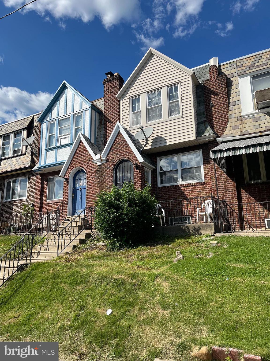 1323 Gilham Street Philadelphia, PA 19111 - Photo 2 of 35 a front view of a house with a yard