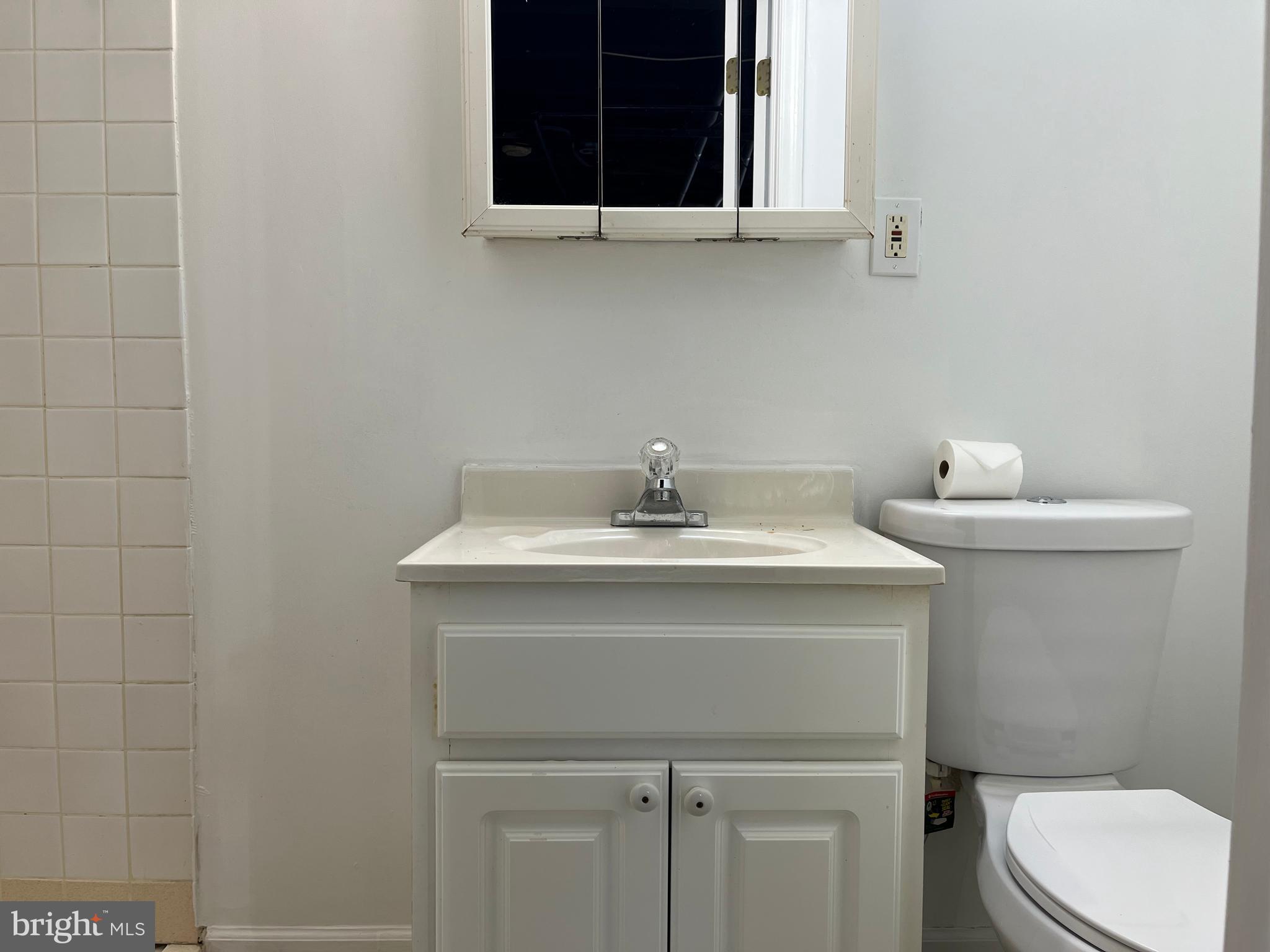 1323 Gilham Street Philadelphia, PA 19111 - Photo 28 of 35 a bathroom with a sink toilet and mirror