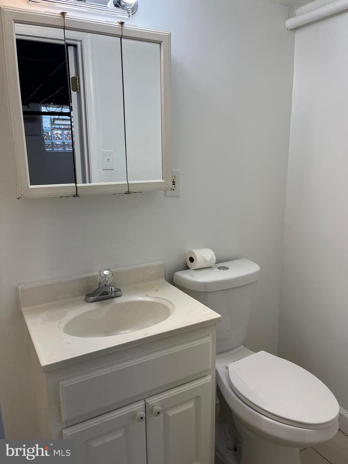 1323 Gilham Street Philadelphia, PA 19111 - Photo 29 of 35 a bathroom with a sink toilet and mirror