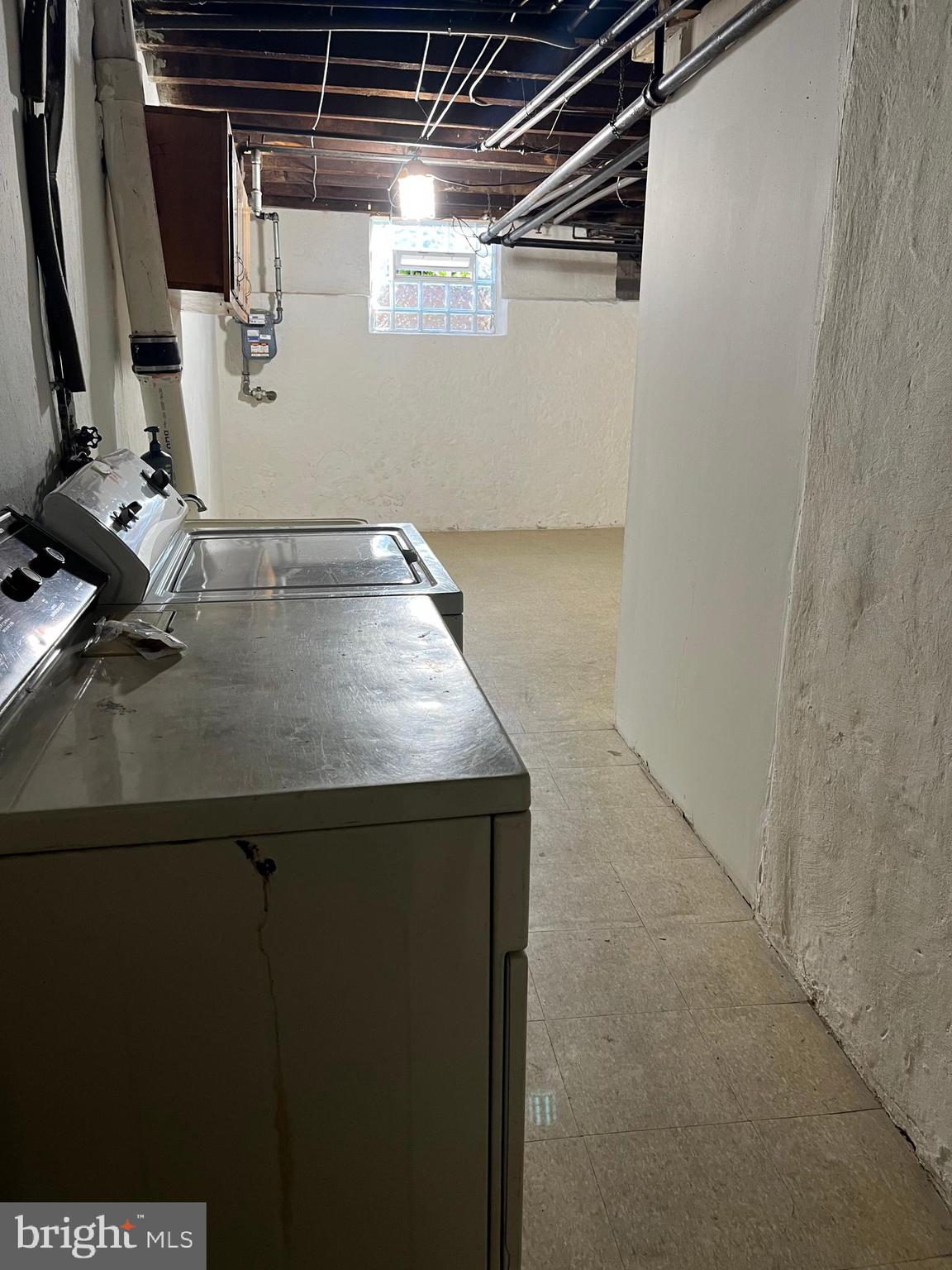 1323 Gilham Street Philadelphia, PA 19111 - Photo 32 of 35 a view of storage and utility room with racks on the wall