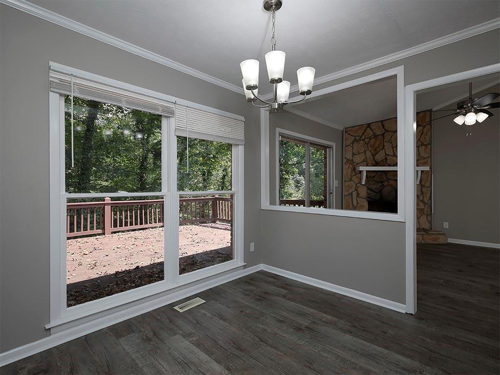 581 Autumn Lane Marietta, GA 30068 - Photo 12 of 28 a view of a room with wooden floor and large windows